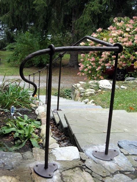 A stair railing kit provides your home with class and sophistication. Wrought Iron Handrail with Hammered Finish | Wrought iron handrail, Railings outdoor, Iron handrails