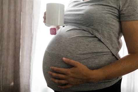 Full Term Pregnant Belly And Raspberry Leaf Tea By Samantha Gehrmann