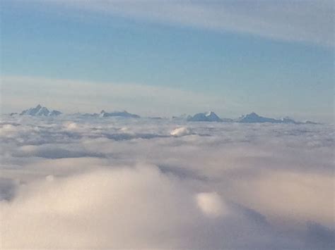 The Swiss Alps Above The Clouds