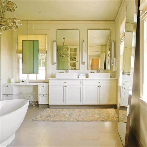 I was under the impression that you could purchase smaller cranks for this reason. Mirror in Front of Window - Transitional - bathroom - NB Design Group