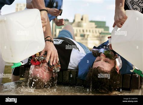 A Group Of Guerrilla Geographers Waterboard Each Other In Front Of The Us Embassy In London