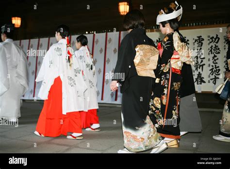 at a traditional japanese shinto wedding ceremony at meiji jingu shrine near harajuku station