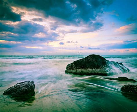 Waves And Rocks On Beach On Sunset Stock Photo Image Of Serene Waves