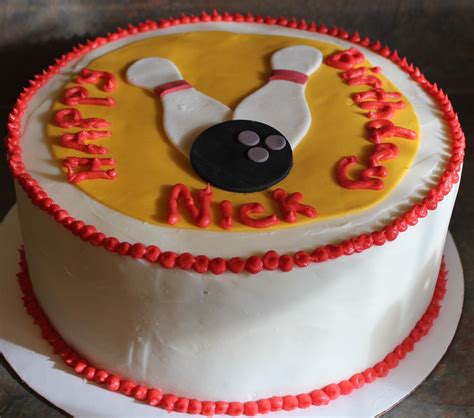 A Birthday Cake Decorated With A Bowling Ball And Pins