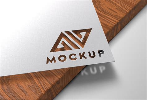 Paper Cutout on Wood Logo Mockup - GraphicsFamily