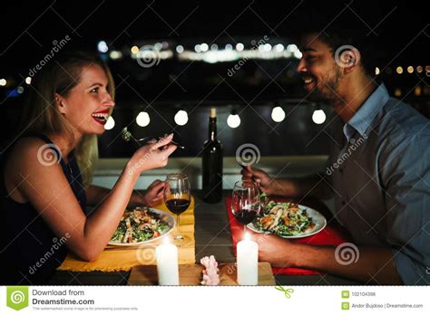 Beautiful Couple In Love Having Romantic Dinner At Night