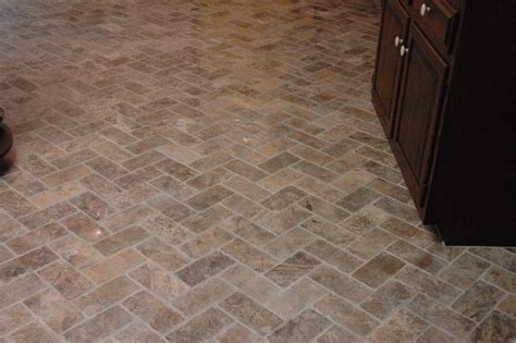 Remember all natural stone tiles must be sealed and stains wiped away immediately. Custom Bathroom Remodeling: Natural Stone Herringbone Tile ...