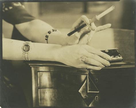 A Woman Holding A Cigarette Holder Photograph By Edward