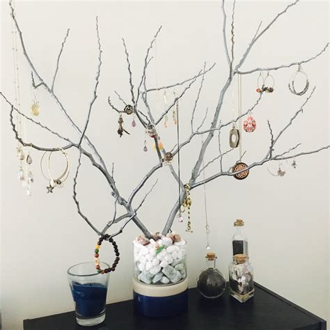 We used jewelry findings in fresh and unexpected ways. Tree branch jewelry holder DIY | Tree branch jewelry, Tree branch jewelry holder, Jewelry tree diy