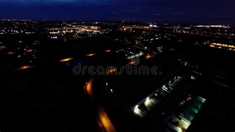 Aerial Night View Of Residential Suburban Neighborhood With Street