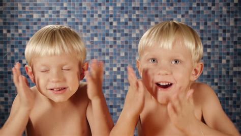 Blond Twin Brothers Using After Shave Stock Footage Video 100 Royalty