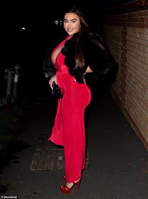 lauren goodger puts on a very busty display in a plunging red jumpsuit for night out in essex