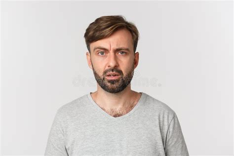 Perplexed Man Standing Holding A Wrench Stock Photo Image Of Casual
