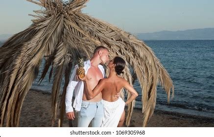 Heterosexual Couple Kissing On Beach Couple Stock Photo Edit Now