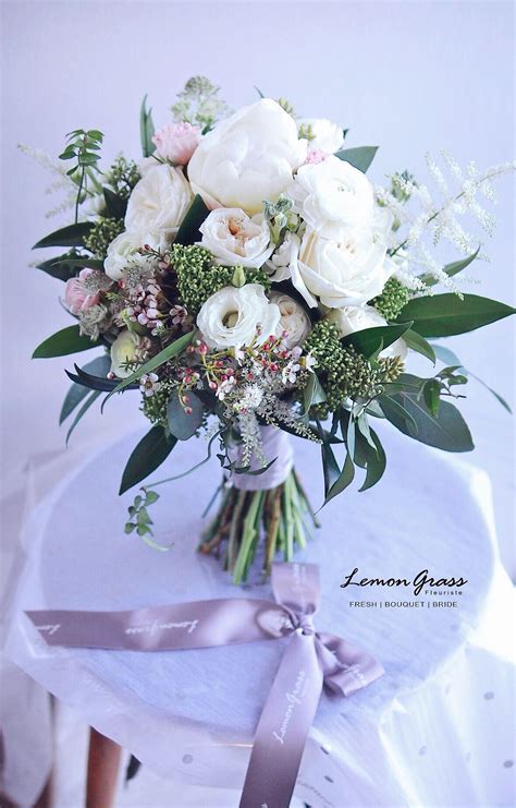 A delicate light pink wedding bouquet with various types of blooms and a simple neutral wrap. Pin by LemongrassWedding on Fresh Flower Bouquets ...