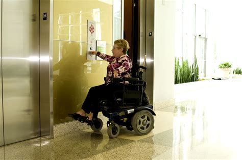 Free Picture Woman Wheelchair Pressing Easily Reachable Button