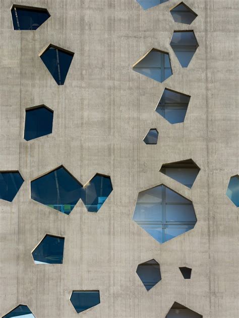 Angular Openings Puncture Concrete Facades Of Lucio Morinis University