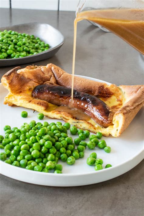 The first reference to the dish by name is in a book named a provincial glossary published in 1787, although it is also referred to as 'meat boiled in a. Toad In The Hole Recipe With Onion Gravy