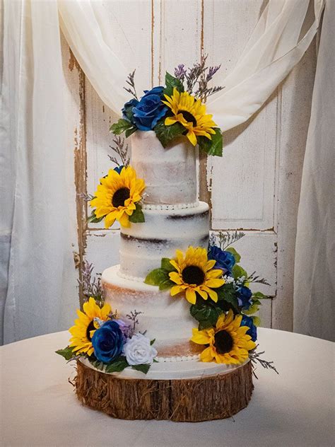 Sunflowers And Blue Roses On A Semi Naked Cake Blue Sunflower Wedding Blue Roses Wedding