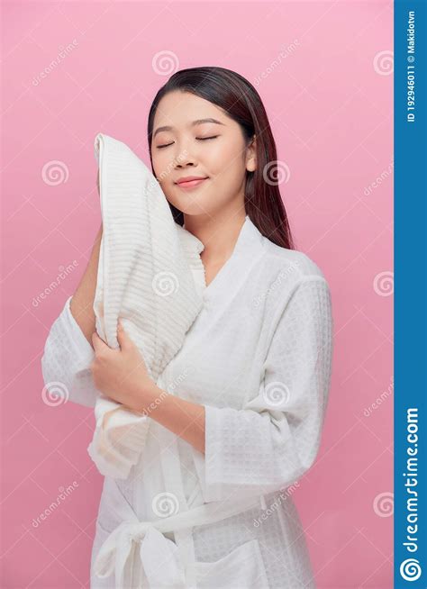 Cheerful Pretty Woman With Healthy Skin Drying Her Face With White Soft