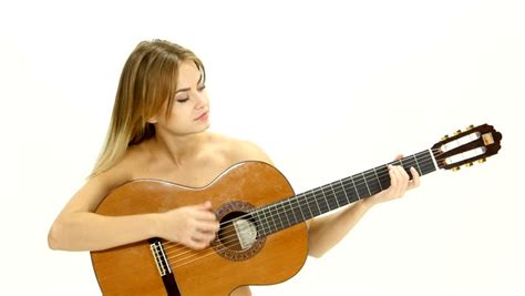 Young Beautiful Caucasian Woman In Casual Playing Guitar