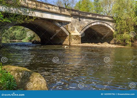 Stone Bridge Spans The River Aire At Cottingley Stock Photo Image Of