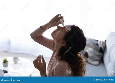 Relieving Itchy Nose Cute Woman Nursing Nasal Cold Or Allergy Sick Woman Spraying Medication