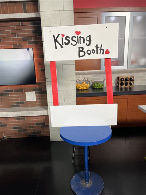 Larry Potash - The WGN Morning News kissing booth is open....