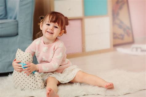 Cute Happy 2 Years Old Baby Girl Playing With Toys At Home Stock Image