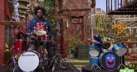 Watch Grover Teach Questlove How To Play Drums On Sesame Street