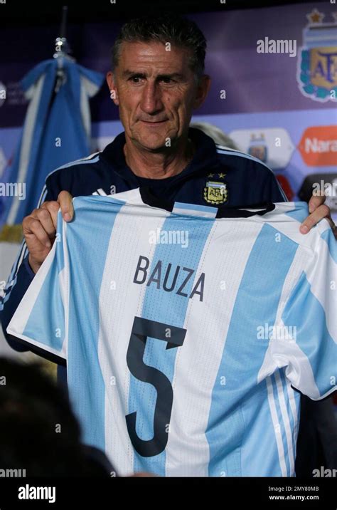 Argentina S New National Soccer Team Coach Edgardo Bauza Holds An Official Jersey With His Name