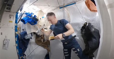 Please Enjoy This Cozy Video Of An Astronaut Getting Ready To Slumber