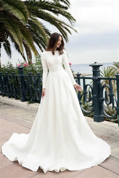 Largest collection of appealing wedding dresses for bride, bridesmaid, wedding guests in any budget & styles. Boat Neck Long Sleeved Ivory Satin Wedding Gown Simple ...