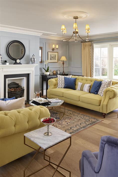 Traditional Luxurious Living Space With Pale Yellow Chesterfield Sofas