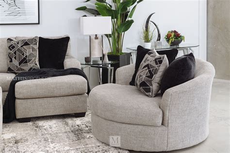 Wrapped in a chunky heavyweight chenille fabric with a. Contemporary 58" Round Swivel Chair in Gray | Mathis Brothers Furniture