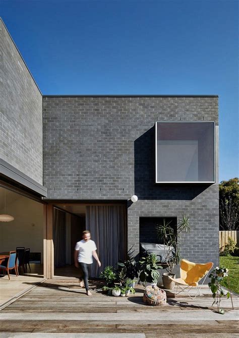 This Black Brick House Features Generous Spaces With A