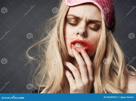 Woman With Pink Mask On Her Head Smeared Red Lipstick All Over Her Face