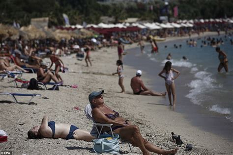 British Tourists Brave Cerberus Heatwave To Pack Benidorm Beaches Sound Health And Lasting Wealth
