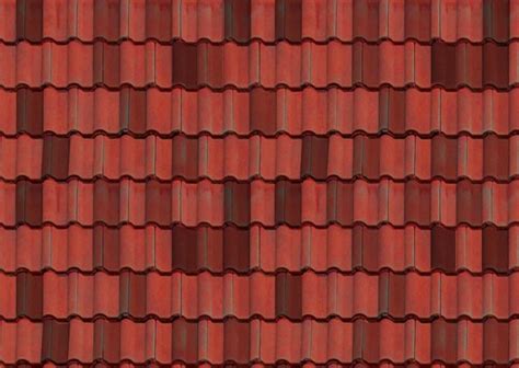 A Close Up View Of A Tile Roof With Brown And Tan Tiles On The Top