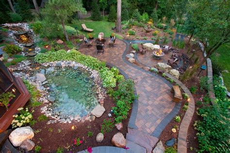 Paver Patio With Natural Rock Pond And Cozy Seating Areas Mickman