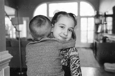 Big Sister Hugging Her Little Brother By Jakob Lagerstedt