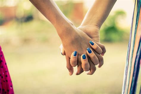 Shallow Focus Photography Of Two Person Holding Hands · Free Stock Photo