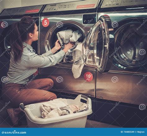 Woman Doing Laundry At Laundromat Shop Stock Image Image Of Tumble