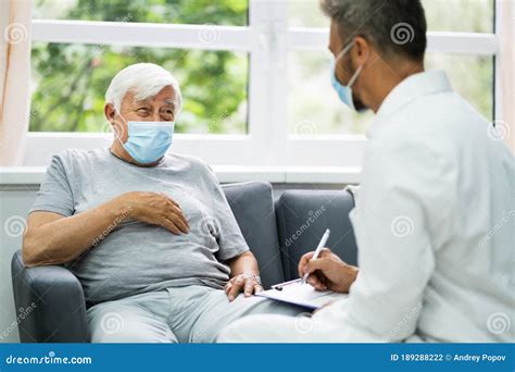 Doctor Talking And Explaining The Treatment Result To Female Patient