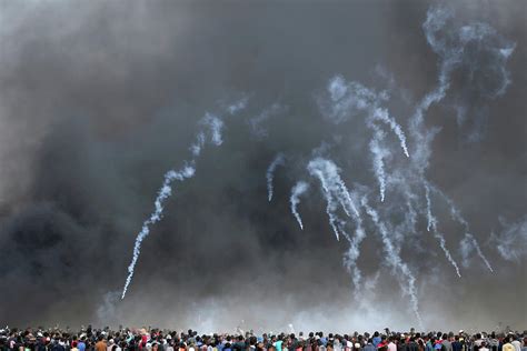 Tear Gas Canisters Are Fired By Israeli Photograph By Ibraheem Abu