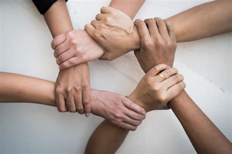 People United Hands Together In Teamwork Premium Photo