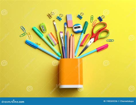 Flat Lay Composition With School Stationery On Yellow Background Back