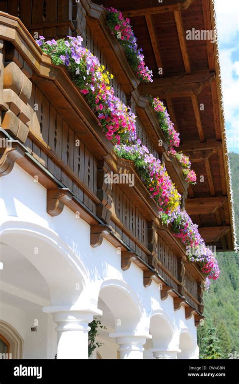 Traditional Austrian Flower Boxes With Red White Flowers Mounted Onto