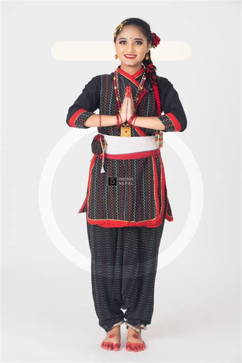 a smiling newari girl with cultural attire offering namaste photos nepal