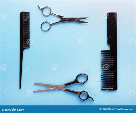 Professional Tools For Hairdresser On Blue Background Hair Combs And